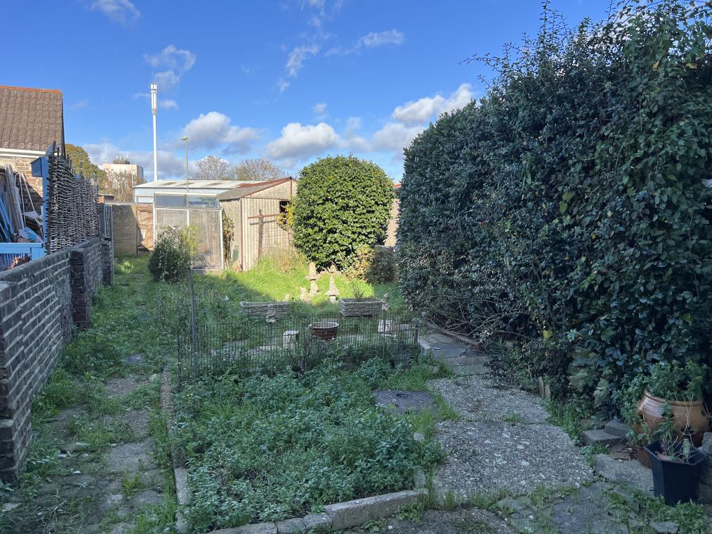 Lot: 146 - THREE-BEDROOM HOUSE FOR IMPROVEMENT - Garden with concrete path and lawn